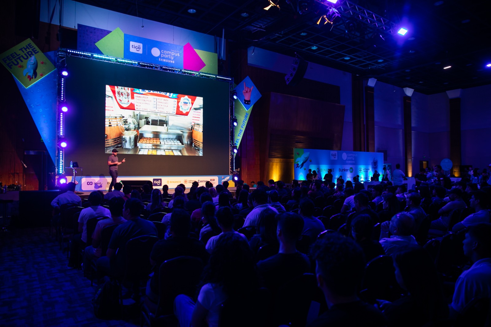 Martin Zuker delivering a keynote on stage